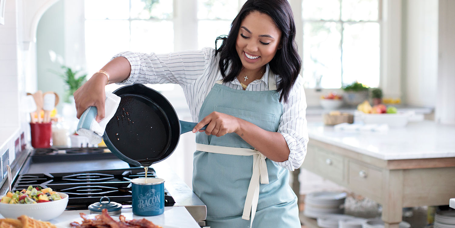 ayesha curry smiling and cooking